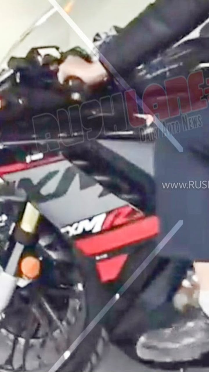 Hero Karizma XMR 250 undisguised spy shot showing aggressive fairing and black paint with red accents