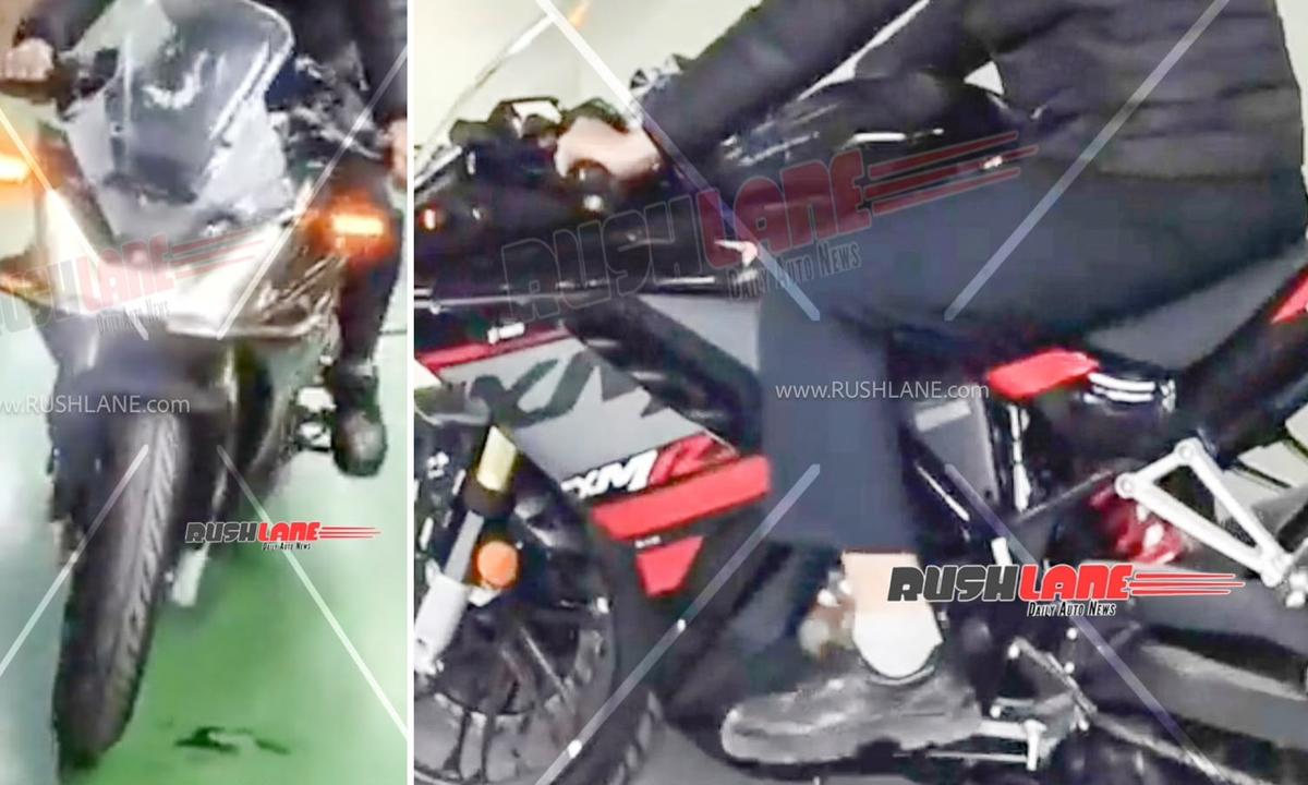 Hero Karizma XMR 250 undisguised spy shot showing aggressive fairing and black paint with red accents