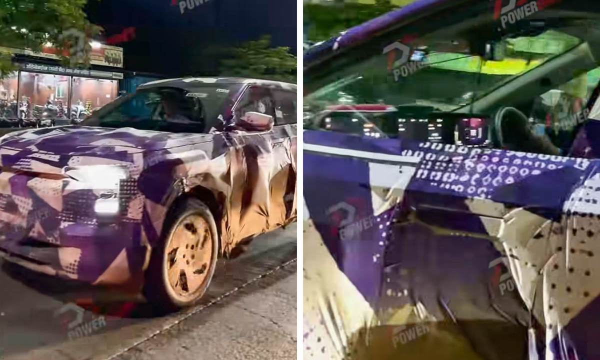 Mahindra BE 7 electric SUV spy shot showing triple-screen dashboard and frameless doors design