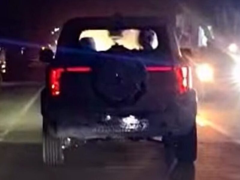 Mahindra Vision S production SUV rear view showing connected LED tail light design during night testing